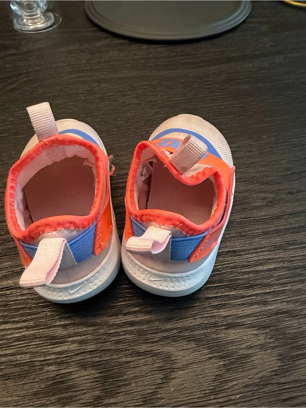 Nike Kids Slip-On Sneakers in Pink with Orange Strap and Blue Accent